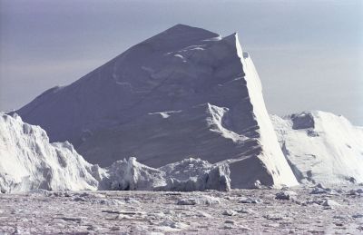 Isfjord, Ilulissat, Diskobay, West Greenland. Huge icebergs (up to 600 ft. high) and calv ice moving out of the Isfjord (Kangia) to the sea.